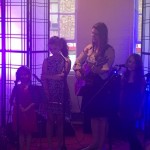 young vocal Students from World Heart Beat Music Academy in London performing for an audience