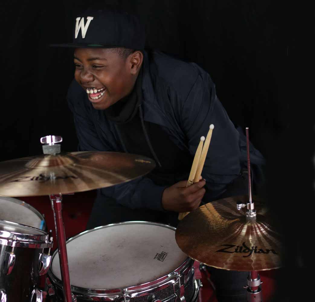 A young student enjoys Drum Kit Lessons in Wandsworth, SW London