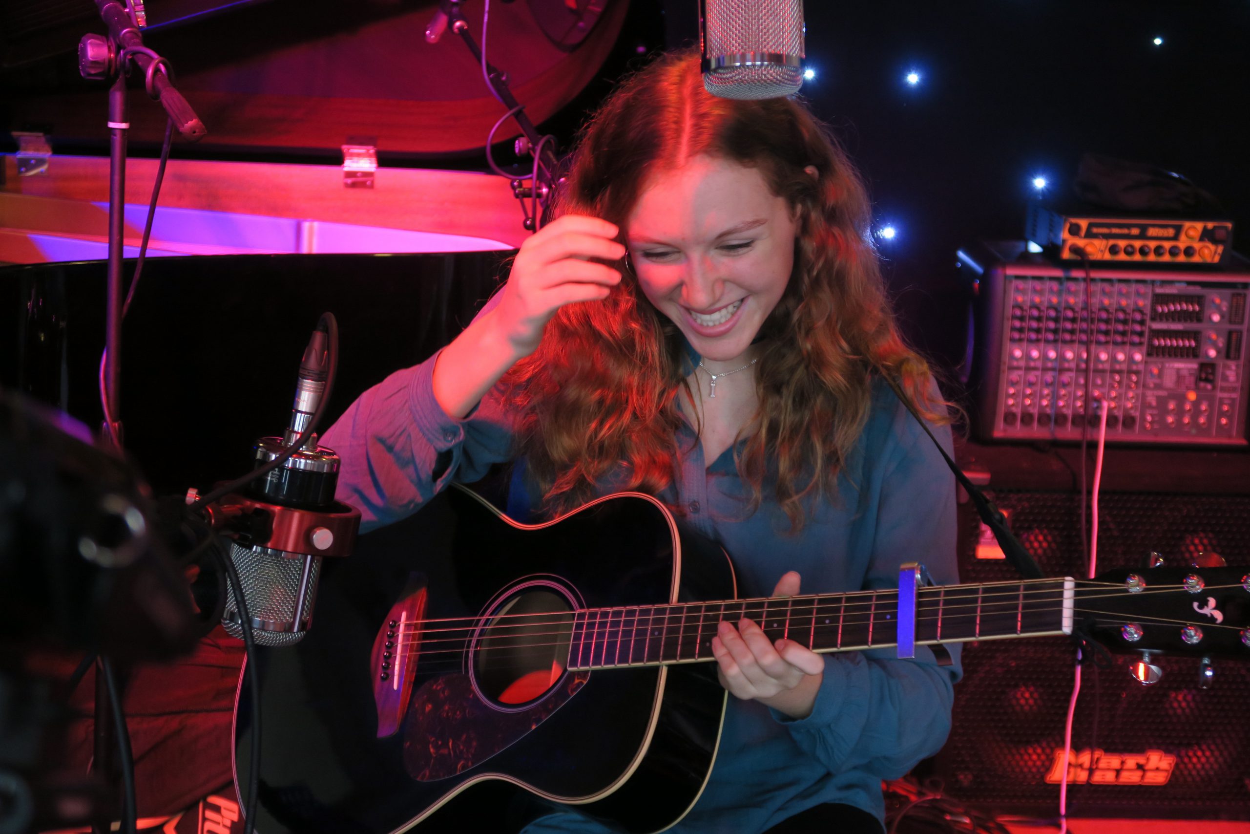 Girl with guitar playing in Contemporary Gig Band