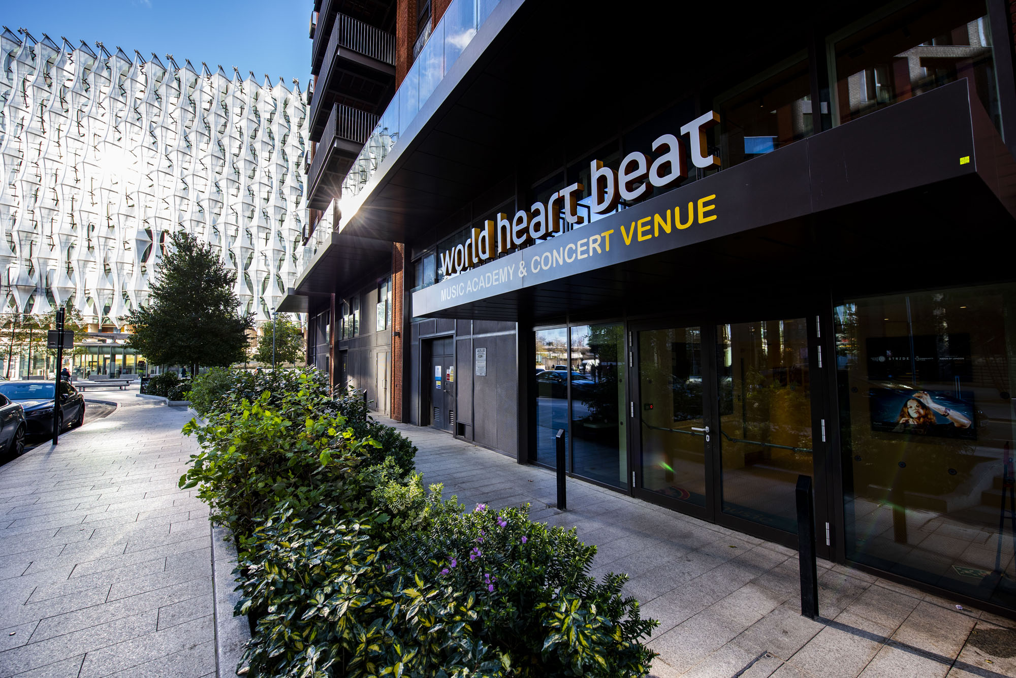 The facade of World Heart Beat Embassy Gardens, with the US Embassy in the background