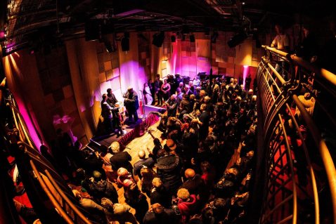 crowd of people in a concert hall